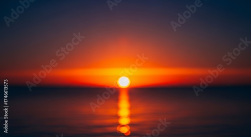 This mesmerizing abstract landscape captures the breathtaking beauty of a sun setting or rising over a calm body of water, rendered with a beautiful bokeh effect. The vibrant sky transitions from warm