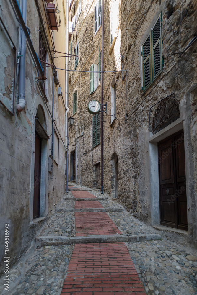Fototapeta premium Narrow street in the ancient village of Ceriana, Imperia, Italy