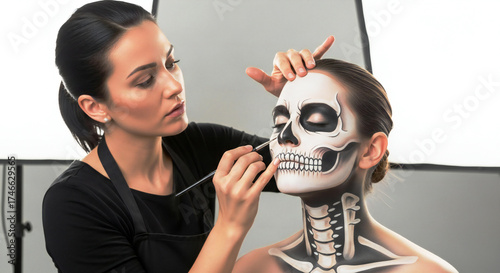 Professional makeup artist applying stunning skull face paint for Halloween or Day of the Dead celebration, creating a striking and dramatic look