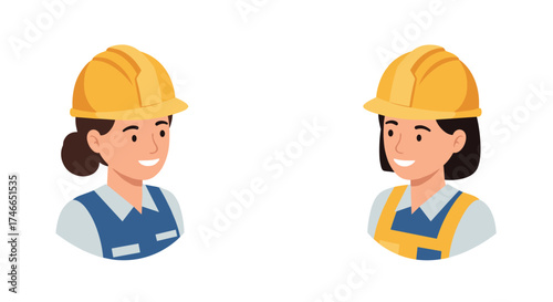 Smiling women engineers in hard hats engaged in conversation