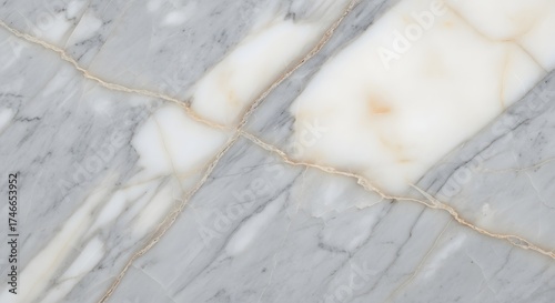 Closeup of a grey and white marble surface with golden veins