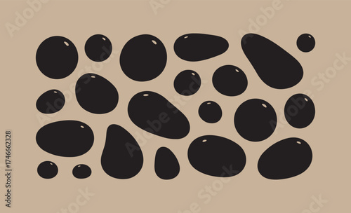 Abstract pattern of black organic shapes on a beige background