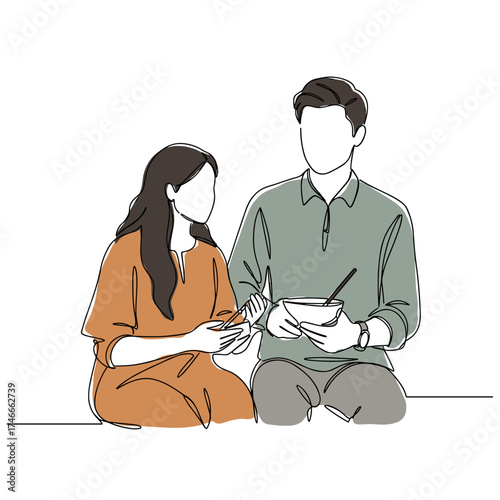 Young couple sharing meal while seated indoors  