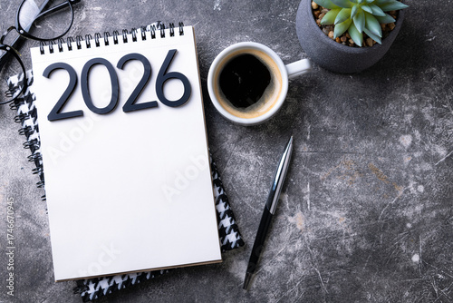 New year resolutions 2026 on desk. 2026 goals list with notebook, plant on colorful background. Resolutions, plan, goals, action, checklist, idea concept. New Year 2026 resolutions, copy space