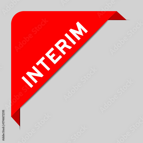 Red color of corner label banner with word interim on gray background
