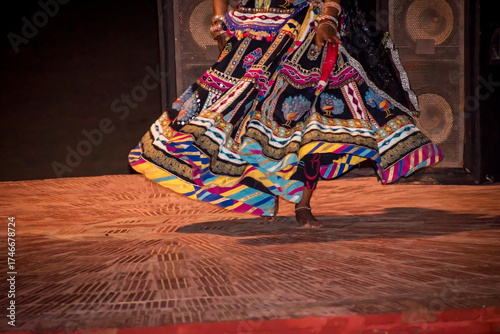 Beautiful Rajasthani dance costume, dancer rotating the lehanga or ghaghra. vibrant Indian culture, grace, and balance, showcasing the colorful attire and art of Rajasthan