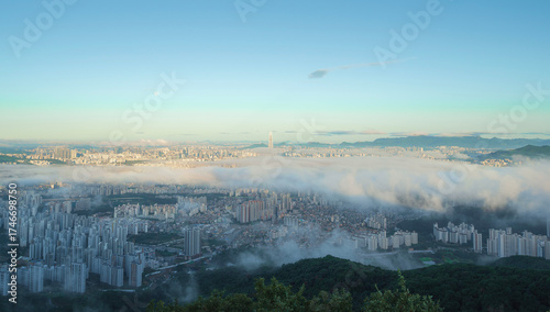 Beautiful Cityscape with Misty Morning City View from Above with Fog
