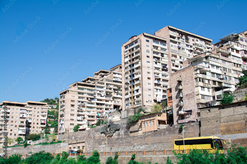 Fototapeta premium A city with beautiful architecture. A beautiful city with tall buildings. The mountainous city of Kapan in Armenia. Nice town