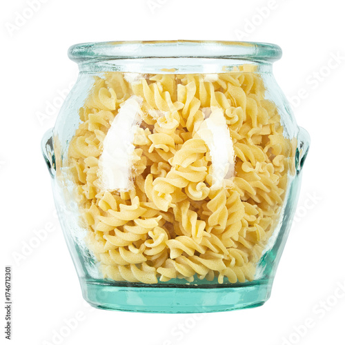 Raw pasta Fusilli in a glass jar isolated on white background. Raw and Dry Macaroni. Italian Culture. Top view.