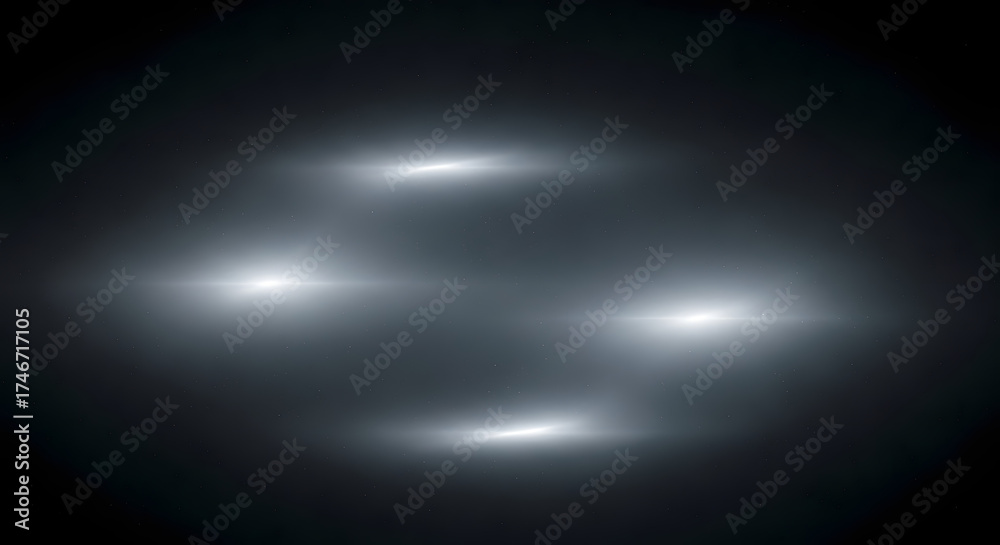 Obraz premium Abstract blurred light streaks and bokeh over dark grayscale background