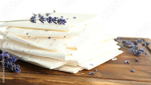 Stack of white sheets with lavender flowers