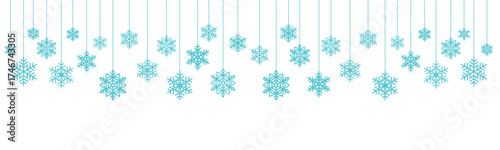 Blue snowflakes hanging on white background