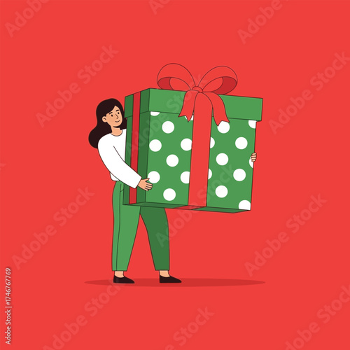 Woman holding a large, festive green polka dot gift box tied with a red ribbon