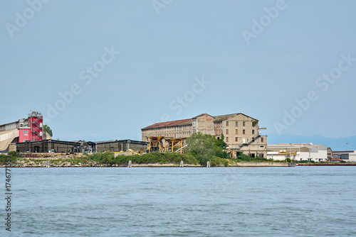 Abandoned and derelict industrial buildings on a canal waterfront