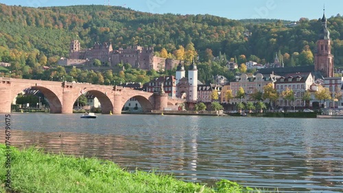 Exploring the beauty of Heidelberg along the serene River Neckar in autumn colors - Germany