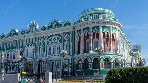Sevastyanov's House or House of Trade Unions on shore of city pond formed by dam on Iset River. Historical and architectural monument located in Yekaterinburg, Russia