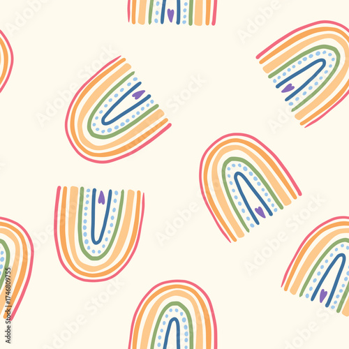 Seamless pattern with colorful hand-drawn rainbows and hearts. Cute boho vector background for kids, textile, wallpaper, wrapping paper, nursery decor, baby prints. Vector illustration.