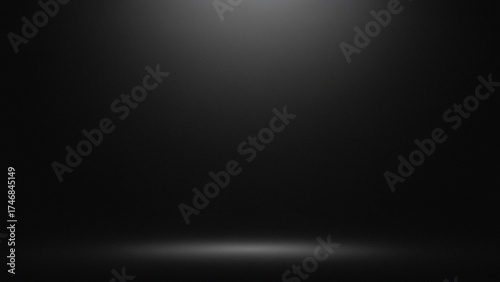 Dark atmospheric background with subtle overhead light rays and soft spotlight on the ground. Ideal for dramatic presentations, product mockups, cinematic effects, or minimalist design compositions.