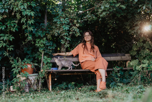 young woman sitting on a bench in the park