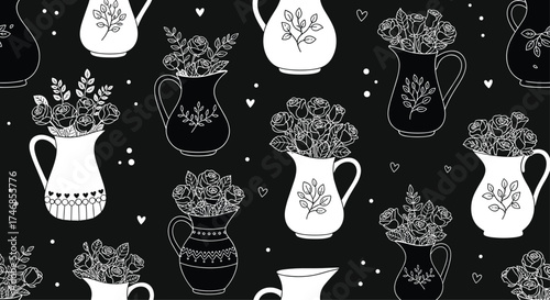 A collection of charming black and white pitchers filled with delicate floral arrangements.