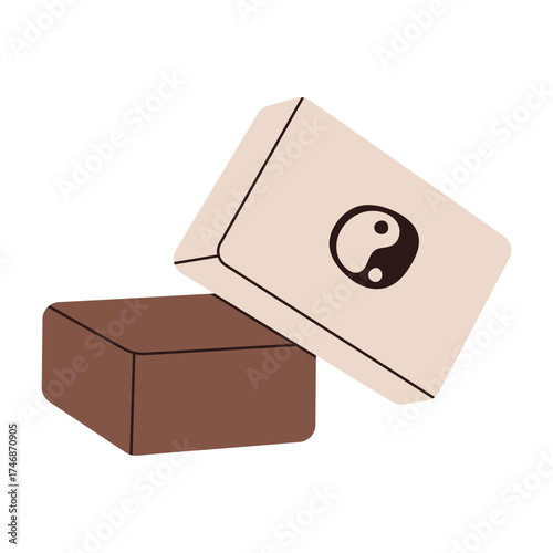 Yoga blocks or bricks with Yin Yang symbol. Equipment for fitness, stretching, and mindful practice.