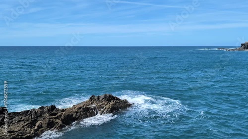 waves hitting rocks at Mirador Hornos de Cal in Ajuy, Fuerteventura on sunny day