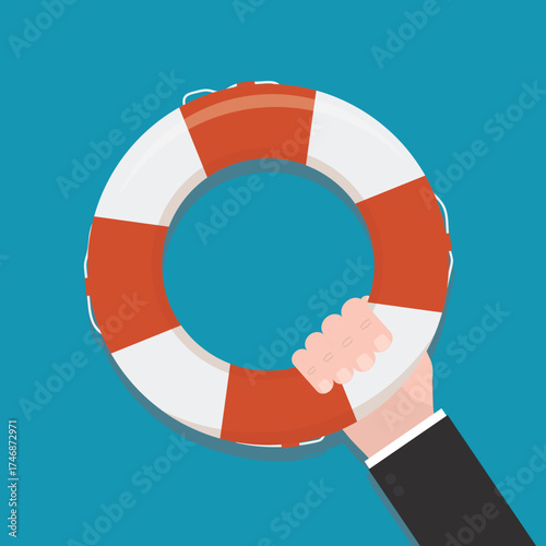 Human hand holding lifebuoy. Insurance, emergency service. Symbol of help or support for survival. Closeup view. Lifebuoy on blue background, top view. Red life preserver