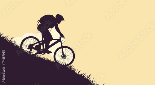 Silhouette of a cyclist riding a mountain bike uphill during sunset.