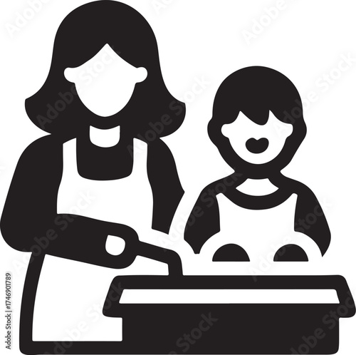Mother and child in aprons preparing food together in the kitchen