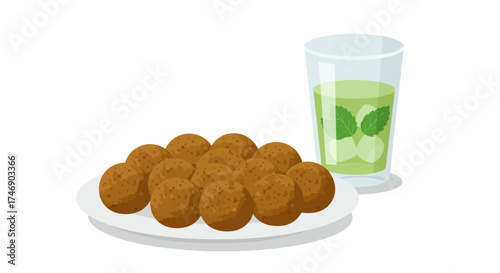 Plate of falafel next to a glass of iced mint drink