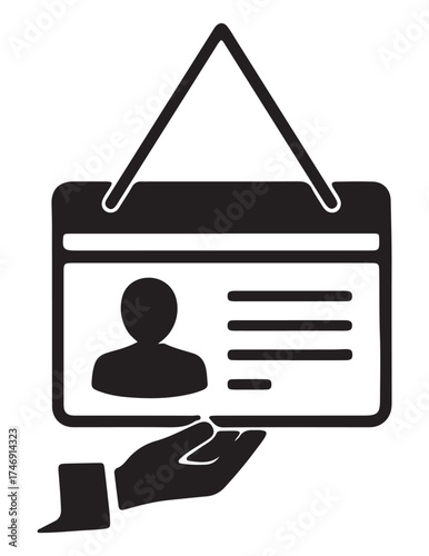 A hand holding an identification card with a person's silhouette and lines for text, suspended by a string.
