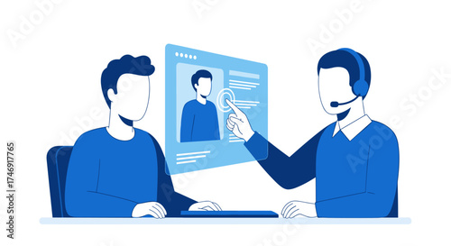 Two men in blue, one with a headset, pointing at a screen with a video call.