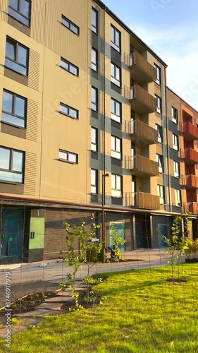 Construction of Modern Apartment Buildings. Safety barriers, fence at completed сonstruction of new apartment building. Colorful Facade. Complete construction of new apartment.
