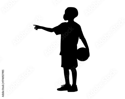 a silhouette of a boy pointing at something while holding a basketballblack, boy, child, hand, man, play, point, profile, stand 