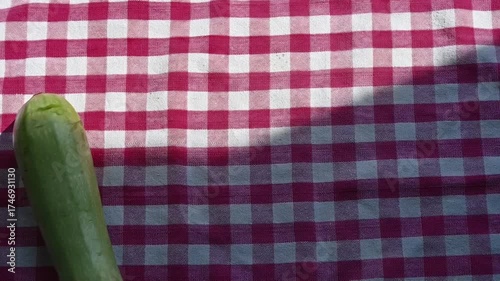 Fresh Green Zucchinis on Kitchen Table in Kitchen Towel