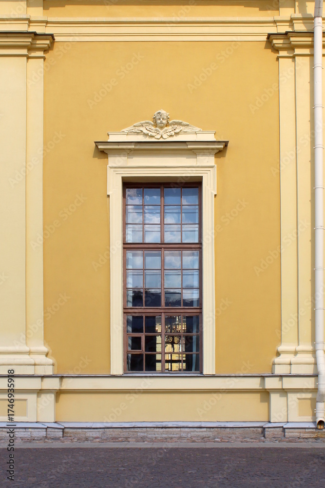 Obraz premium A tall window in a historic building.