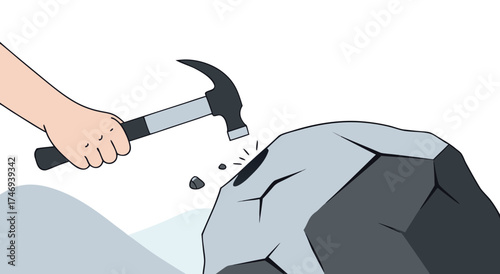 Hammer hitting a large rock to break it apart.

