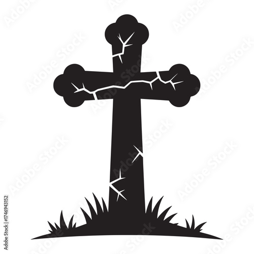 Silhouette of a weathered and cracked stone cross standing in overgrown grass