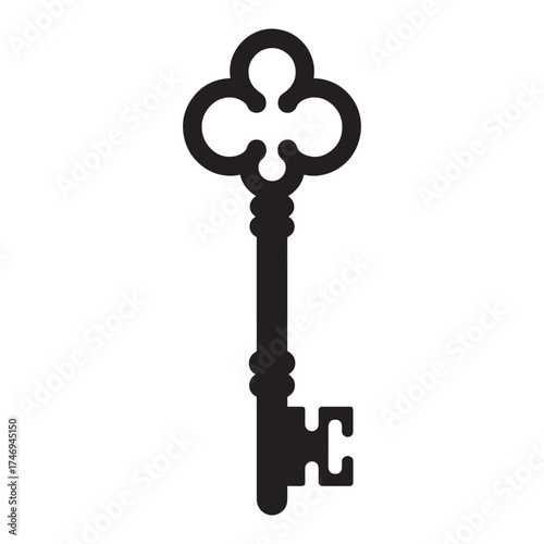 Ornate antique skeleton key with clover shaped bow isolated on white background
