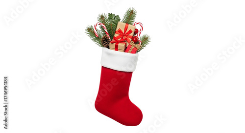 Red and white Christmas stocking filled with gifts, a festive holiday decoration isolated on white