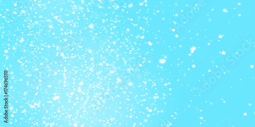 Blue snowfall background with soft falling snowflakes, winter seasonal atmosphere, winter morning Snowflakes are falling from the sky randomly, Falling snow background on blue background.