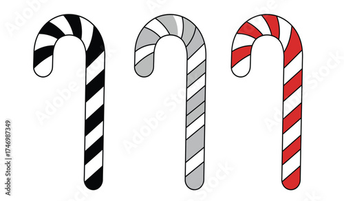 Three classic candy canes with red white and black stripes isolated festive christmas treats isolated on white background