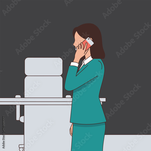 Businesswoman talking on phone in office setting.