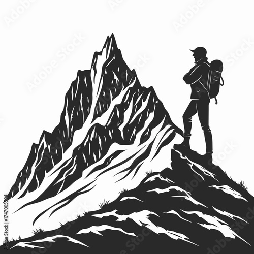 Black silhouette of a hiker on a rugged mountain peak