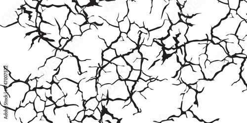 Black Cracks on White Surface: Detailed Texture and Pattern.