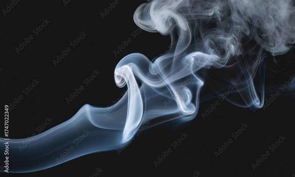 Fototapeta premium Wispy smoke swirls against a black background