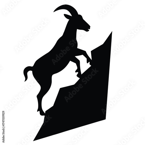 Black goat climbing rocky mountain silhouette