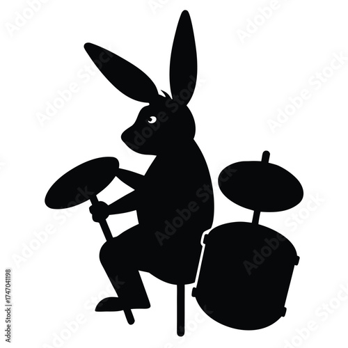 Black rabbit plays drum kit bunny drumming