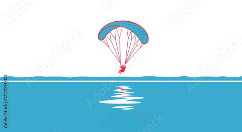 A person paragliding over a calm blue ocean with a reflection.