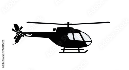 Silhouette of a sleek modern helicopter in flight.